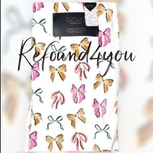 Rachel Roy - ‘Bows - Pink’ plush throw. 60” x 70“. NWT. Firm!